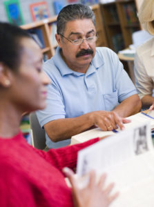 Mature students studying in library