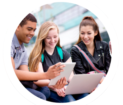 Three young adults reading a paper.