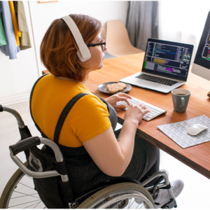 young adult in wheelchair at a computer