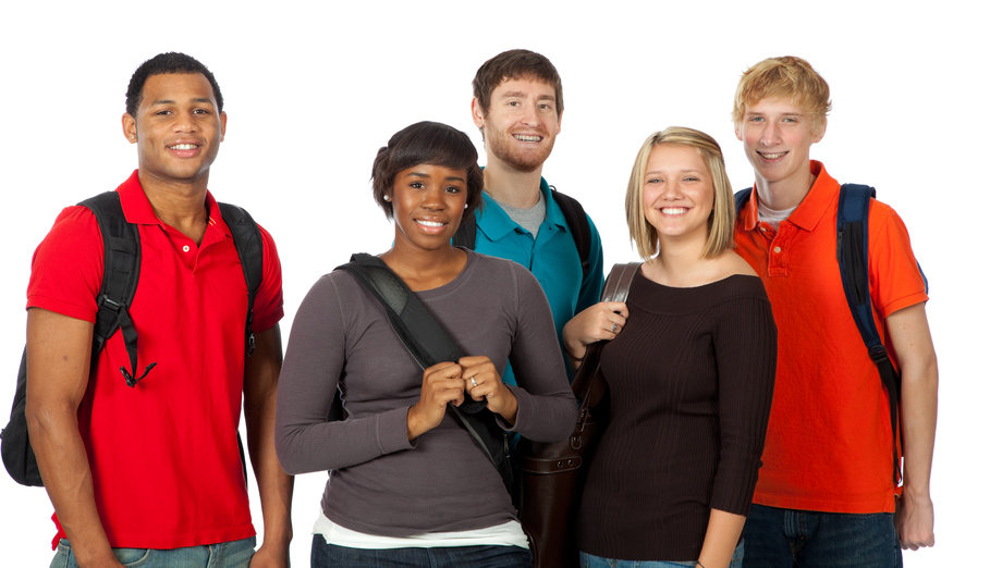 A group of happy multi-racial college students holding backpacks on a white background